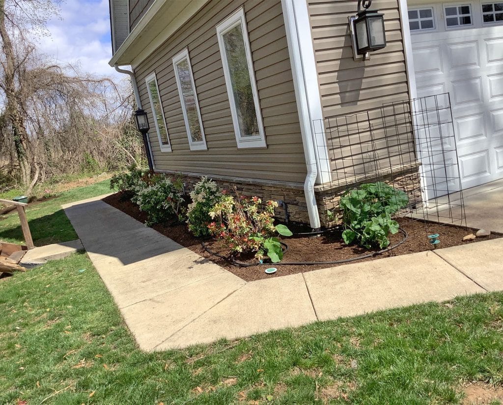 hand weeding garden cleanup and mulch after mowcow crews spruced it up